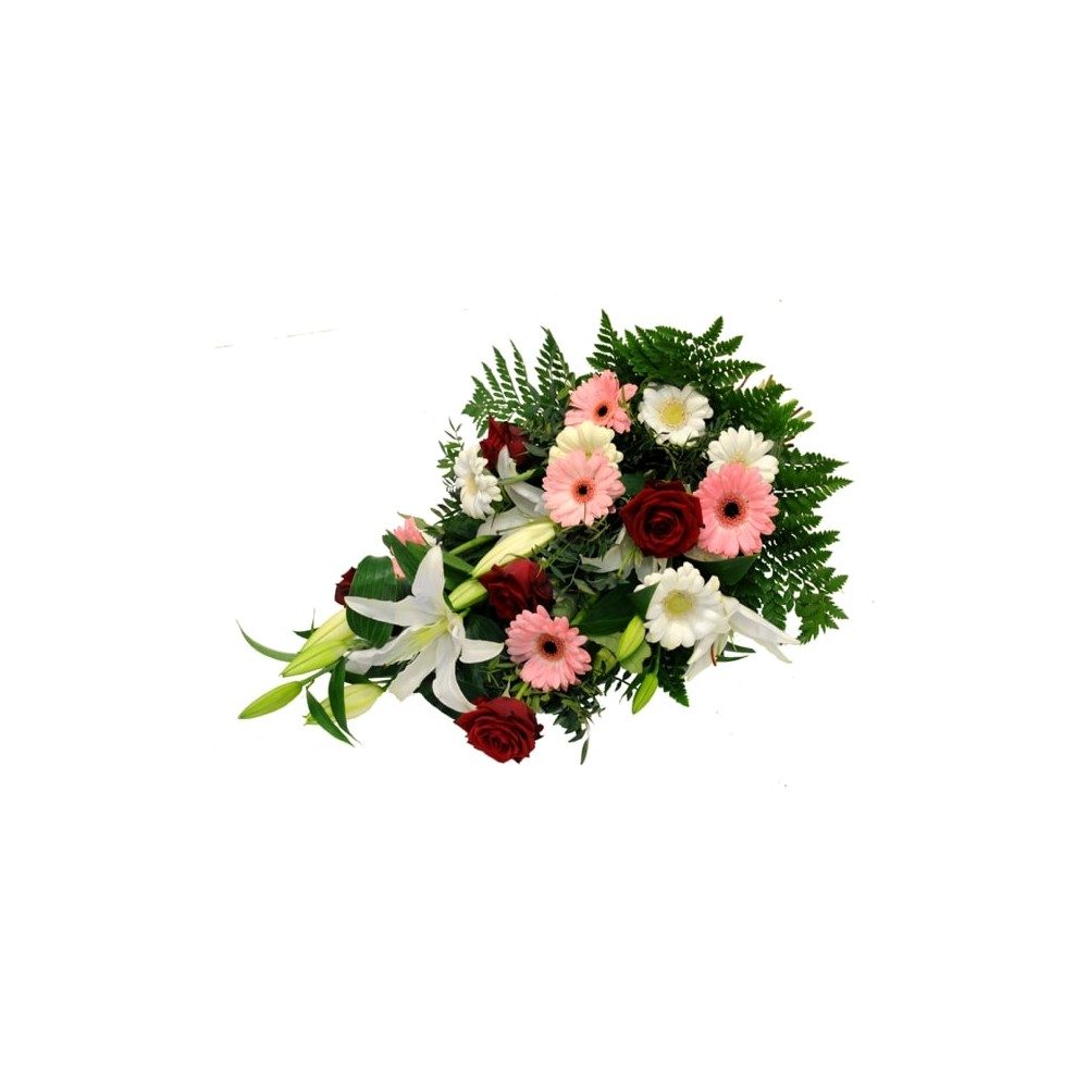 Begravningsbukett med bl.a. rosor, liljor och germini.