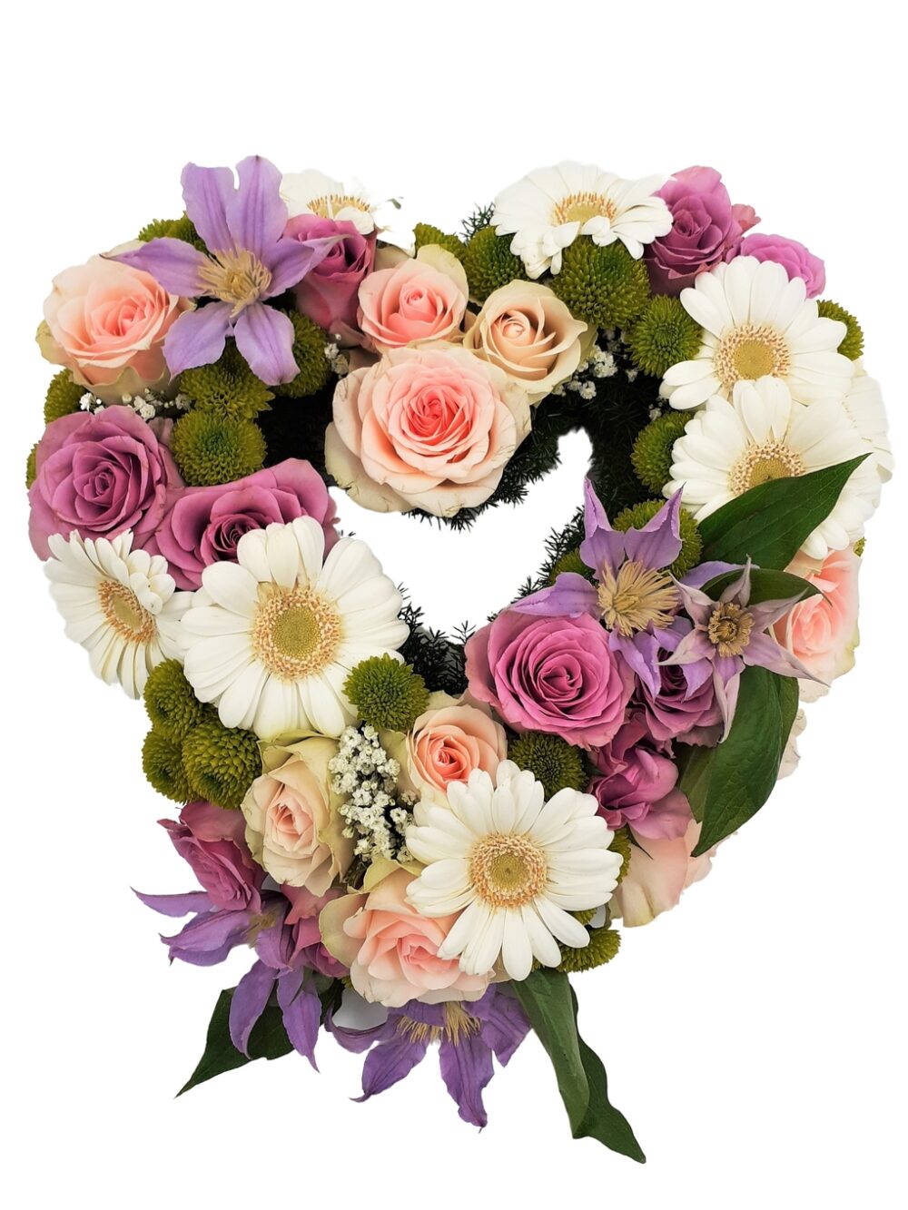 Blomsterhjärta av rosor, gerbera och krysantemum i pastellfärger hos Bellis blomsterhandel.